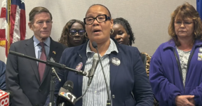 Image from a recent press conference on changes to nursing student loan caps.